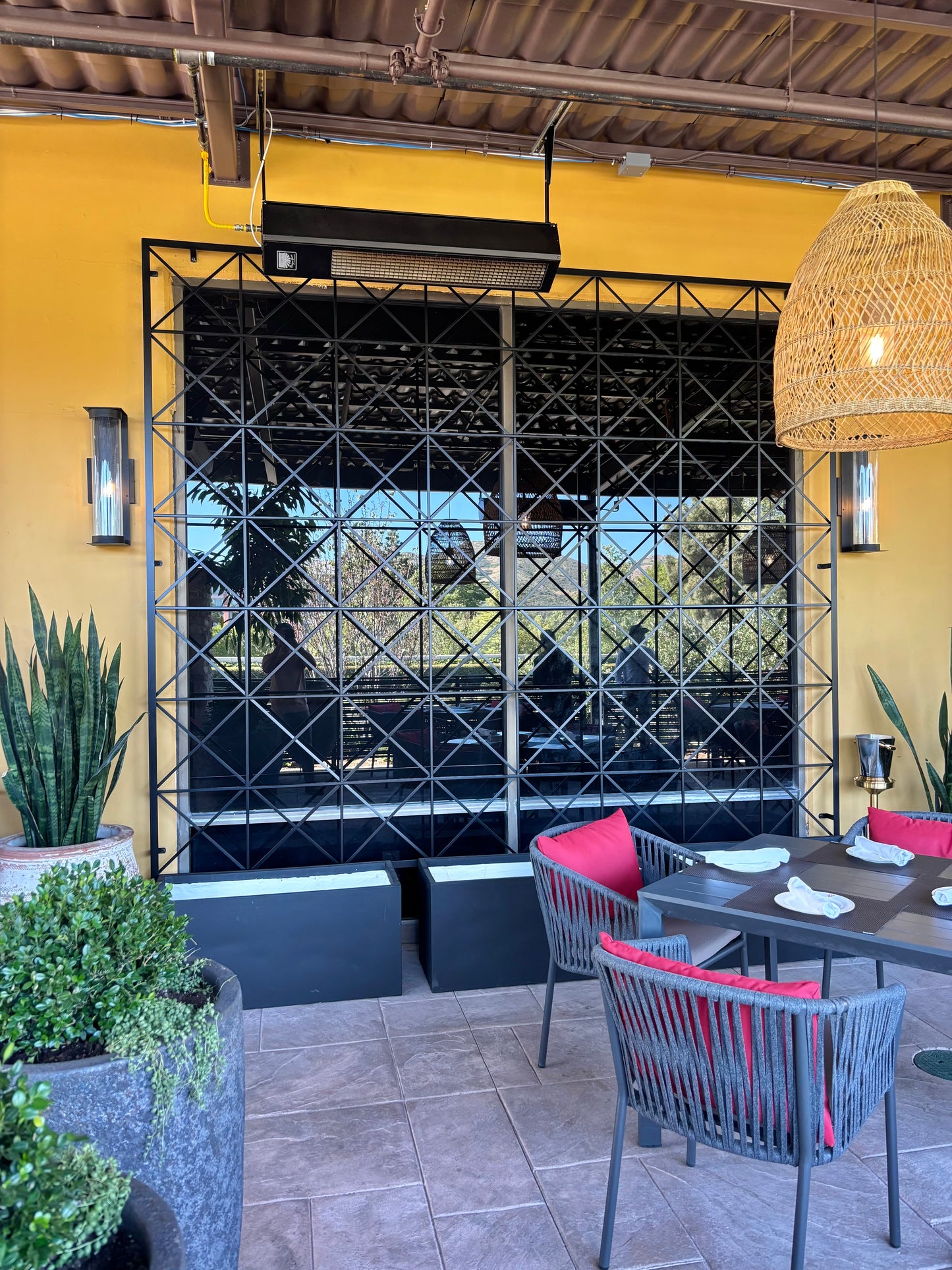 mediterranean style patio with 10 foot trellis