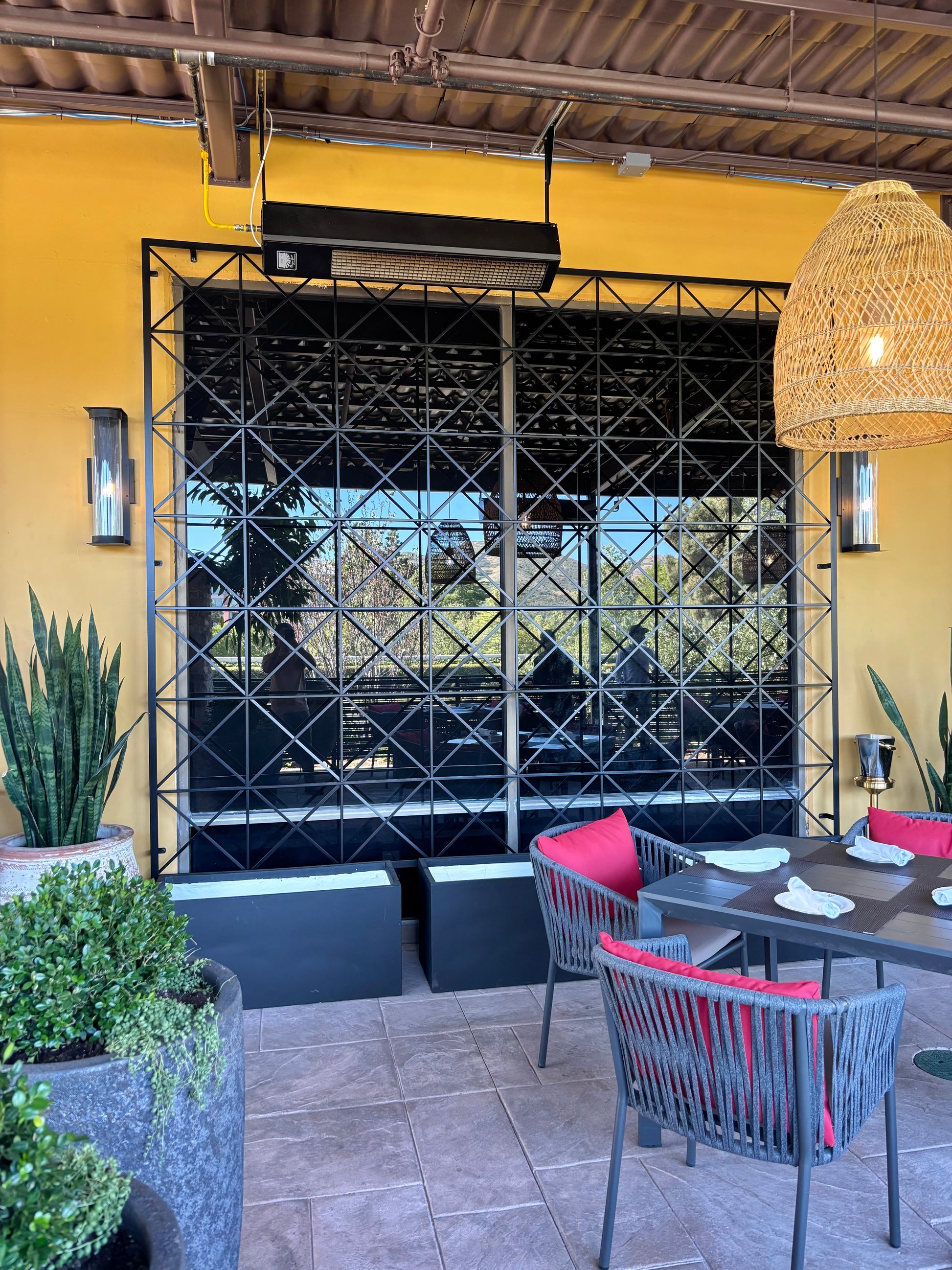 mediterranean style patio with 10 foot trellis