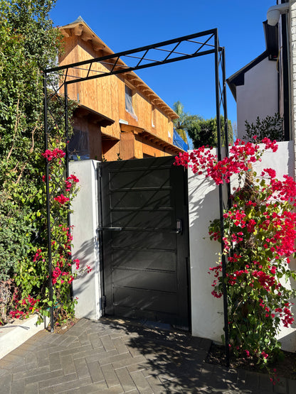 black diamond grid arbor arch on garden pathway