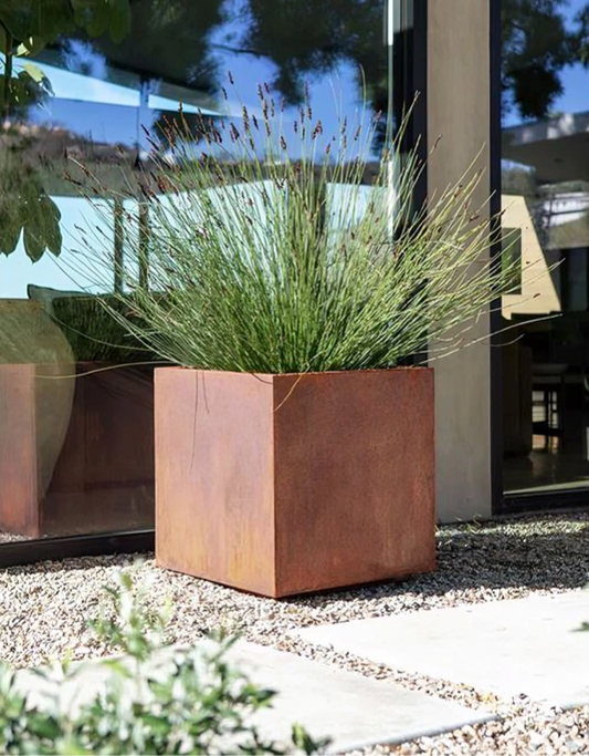 commercial grade corten steel planter with drought resistant  grasses 