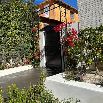 Mediterranean style front yard with diamond garden arbor from s2n industries 